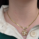 Floral spin necklace