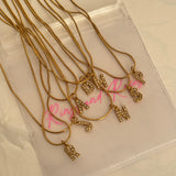Initial studded necklace